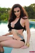 Harriet H Bursting Out Of Her Black Bikini a6vmmjayce