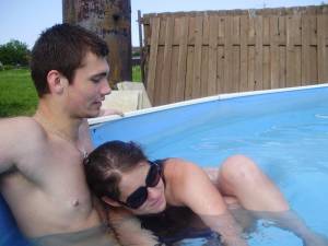 A young couple playng in the pool [x37] r6x2htgeez