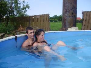 A young couple playng in the pool [x37] i6x2hs7efp