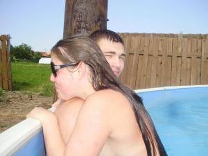 A young couple playng in the pool [x37] l6x2hstq6z