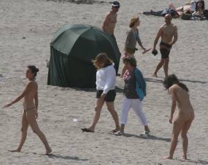 Topless girl goes full-nudist at textile beach  Almeria (Spain)j6x55602ab.jpg