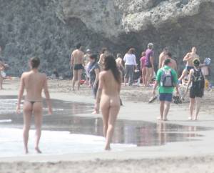 Topless girl goes full-nudist at textile beach  Almeria (Spain)z6x55661yu.jpg