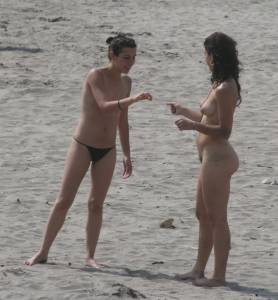 Topless girl goes full-nudist at textile beach  Almeria (Spain)-c6x55634rn.jpg