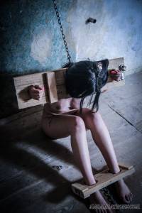 Young nude slave waiting shackled in the dungeon-66xk3vw5sb.jpg