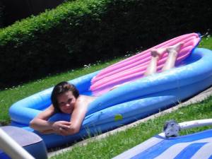 Teens Enjoy a Small pool in the Backyard x 104 g7bh411grw