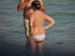 A Topless MILF With Her Husband on the Beach 57bnm1h1m3